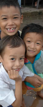 Laos (Svannakhet) 3 boys  copyright Chris Smith csmith@csmith.info (photographer)