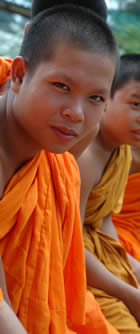 Laos (Pakse) : Buddhist student monk at school : copyright Chris Smith csmith@csmith.info (photographer)